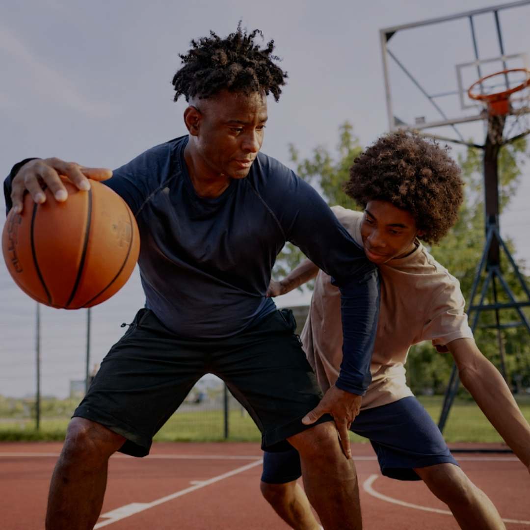 Two young men playing competitive bas